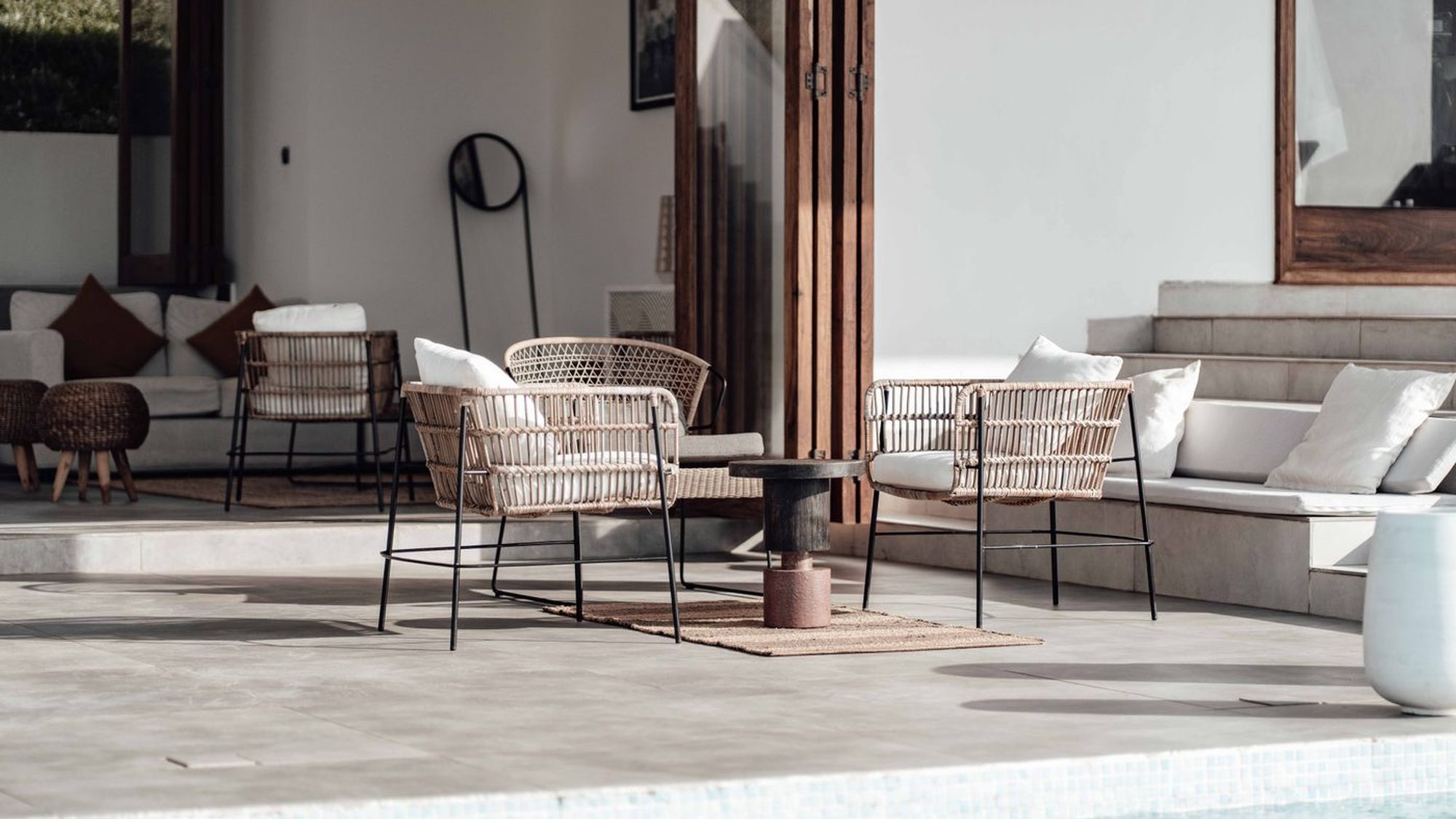 A clean paved patio with furniture